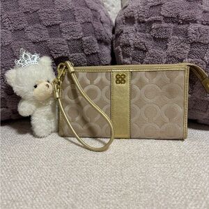 Coach Metallic Gold Wristlet with Magenta Interior
